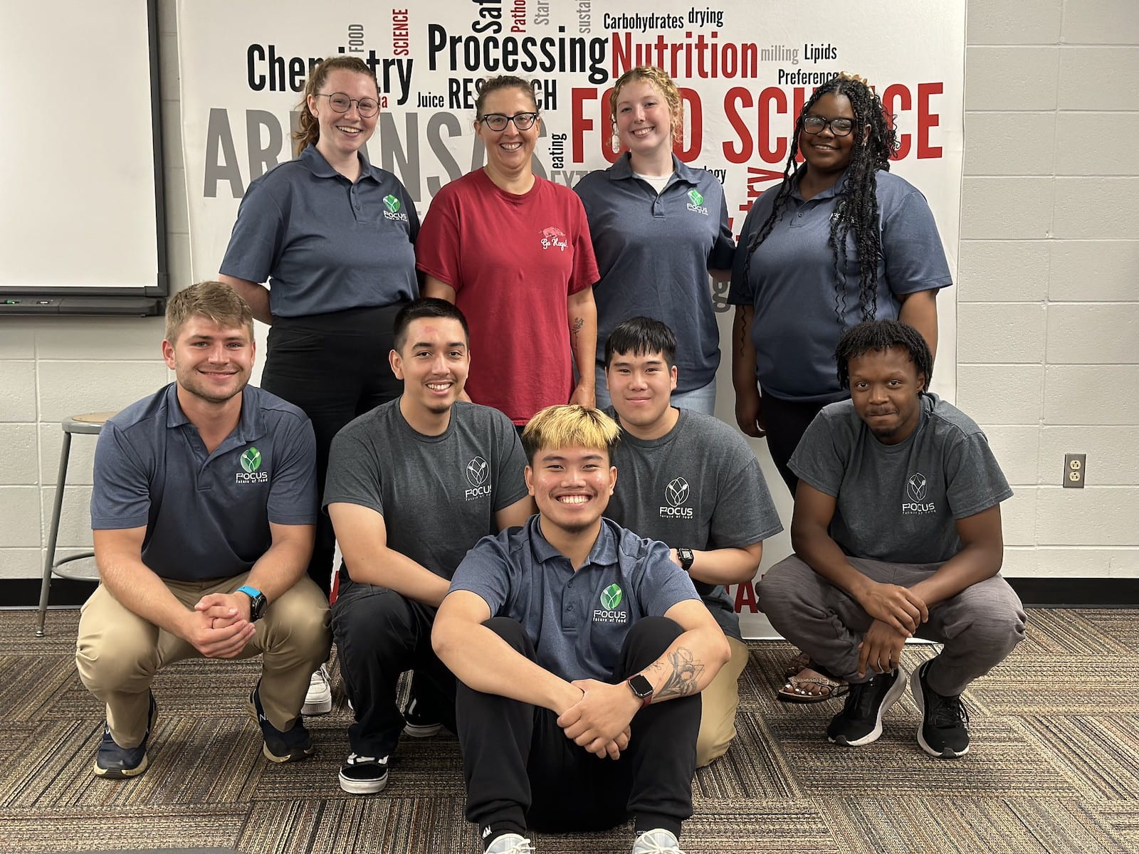 FOOD FOCUS — The 2023 F2OCUS class included eight students, seen with Andrea Myers, food science program technician and product development leader. Pictured are Alyssa Finocchiaro, back left; Myers; Gracie Howard; Kennedy Christmas; Nicholas Stall, front left; Alex Rosales; Alex Lee; Aidan Douglas; and Keith Andzrej Monsalud, front-center. (U of A System Division of Agriculture photo)