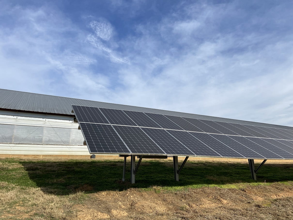 SOLAR POWER — Solar panels provide power to a poultry house. The Poultry Solar Analysis tool has been updated with information to help agricultural producers make timely decisions about using solar power on the farm. (U of A System Division of Agriculture photo)